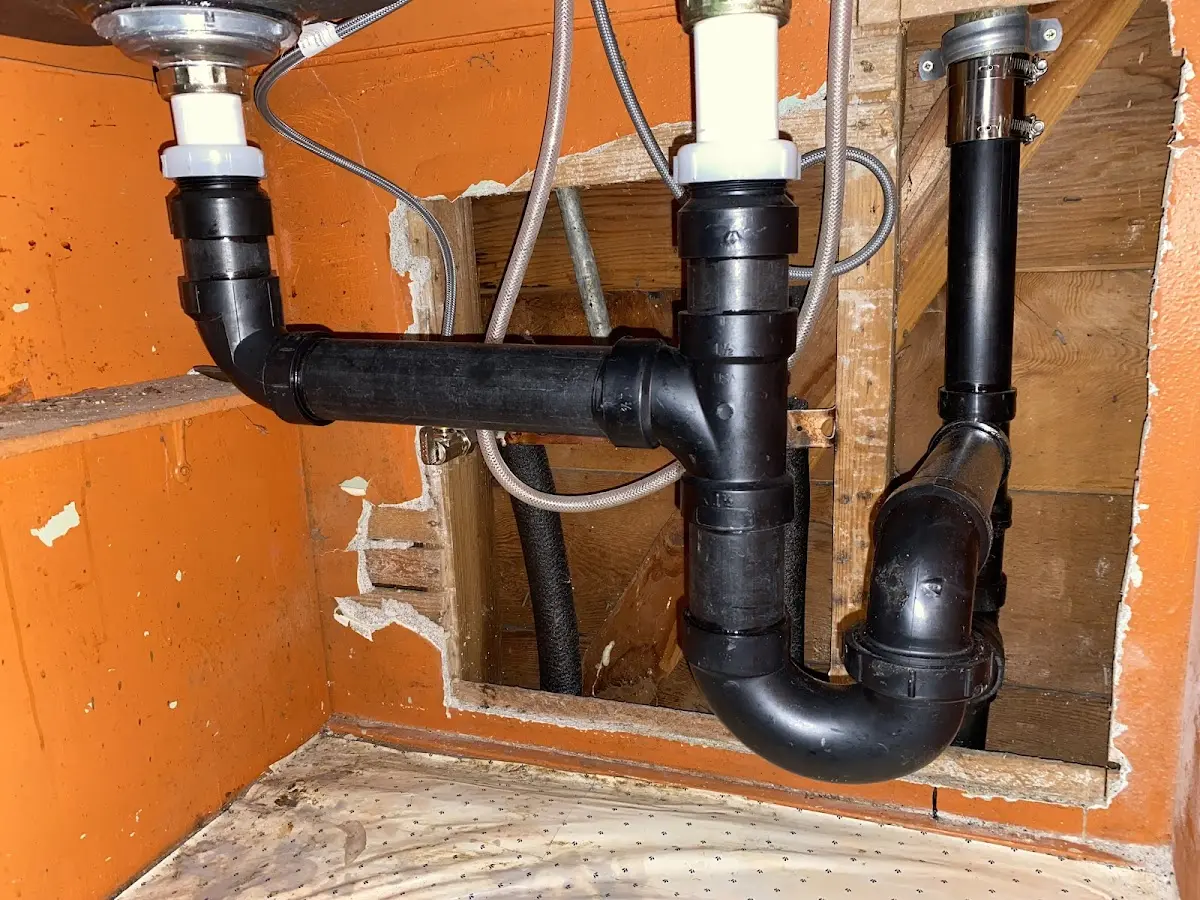 Professional Garbage Disposal Repair equipment and tools on the job in Bryan